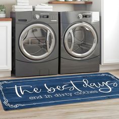 a washer and dryer sitting next to each other in front of a door