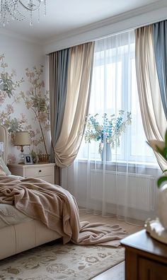 a bedroom with floral wallpaper and drapes on the windowsill, bed in foreground