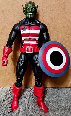 the action figure is holding a shield