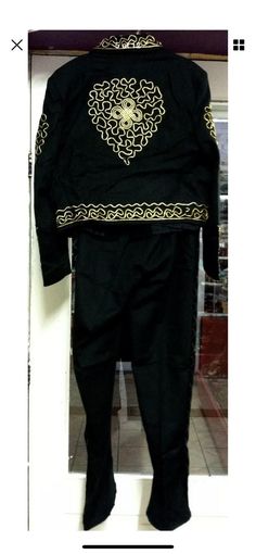 a black suit with gold details on it