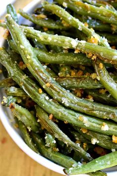 green beans with seasoning in a white bowl