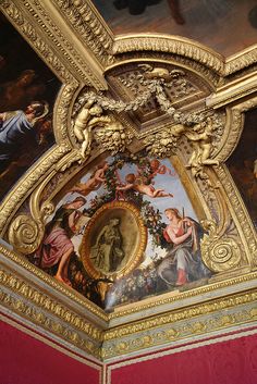 an ornate ceiling with paintings on it