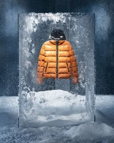 an orange jacket sitting in the middle of ice