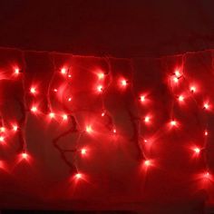 red lights are strung up on the wall