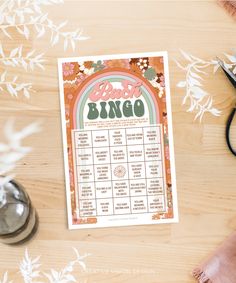 a printable wedding game is shown on a table with flowers and other items around it