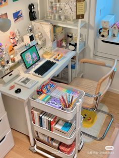 a desk with a laptop computer on top of it next to a book shelf filled with books