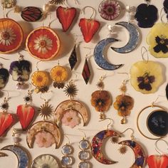 an assortment of earrings and pendants on display