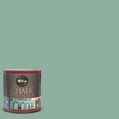 a can of chalk paint on a green background