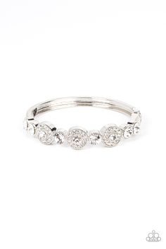 Bordered in rings of glassy white rhinestones, a trio of white rhinestones alternate with oversized white rhinestones across the front of a bangle-like bracelet for a glamorous twist. Features a hinged closure. Sold as one individual bracelet.