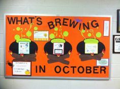 an orange bulletin board with three cartoon figures on it and what's brewing in october