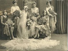 an old black and white photo of bridesmaids