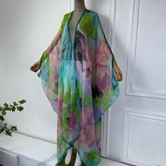 One Size fits S-4X Length: 52 inches Material: Chiffon (Sheer, soft and silky to the touch with a beautiful drape and flow) One Size Fits Most Size Chart Elegant Multicolor Kimono For Beach, Elegant Multicolor Beach Kimono, Green Long Free Size Cover-up, Green Free Size Long Cover-up, Elegant Flowy Multicolor Kimono, Elegant Multicolor Flowy Kimono, Cover Up Kimono, Sheer Cover Up, Beautiful Drapes