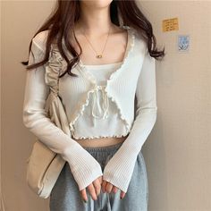 Harajuku Korean Fashion Ruffle Lattice String Tie Cropped Cardigan SIZE INFO One Size - Bust 82cm/32.2", Length 42cm/16.5" NOTE: DUE TO VERY HIGH DEMAND, PLEASE ALLOW 12-20 DAYS FOR DELIVERY TO THE US, AND 20-45 DAYS TO THE REST OF THE WORLD. White Casual Ruffled Cardigan, Casual Long Sleeve Ruffle Cardigan, Casual White Ruffled Cardigan, White Casual Cardigan With Ruffles, Spring Trendy Ruffled Cardigan, Trendy Ruffled Spring Cardigan, Trendy Ruffled Winter Cardigan, Tie Cardigan Outfit, Tie Front Top Outfit