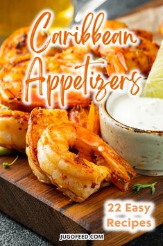 a wooden cutting board topped with shrimp and dipping sauce