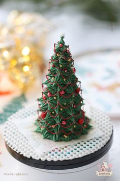 a small christmas tree is on a plate