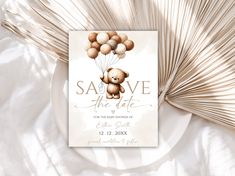 a card with a teddy bear holding balloons on it's back and the words save the date written in gold