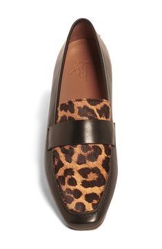 Elevate your wardrobe with a soft leather loafer featuring a leopard printed genuine calf hair vamp for eye-catching style. OrthoLite® footbed Leather and genuine calf hair upper/leather lining/leather and rubber sole Imported Asian Owned/Founded Luxury Calf Leather Loafers With Textured Sole, Leopard Print Leather Loafers For Fall, Designer Calf Leather Slip-on Loafers, Fall Leopard Print Loafers With Round Toe, Leopard Print Flat Heel Loafers For Work, Leopard Print Leather Loafers For Work, Luxury Brown Calf Leather Loafers, Fall Leopard Print Round Toe Loafers, Fall Leopard Print Leather Loafers