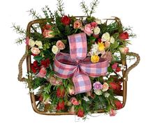 a basket filled with lots of flowers on top of a table