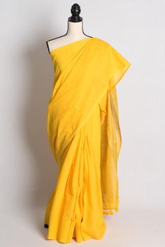 Elevate your wardrobe with our blended Soft Cotton Saree in Bright Yellow from Bengal Looms. This exquisite saree blends comfort and elegance, perfect for any occasion. Its vibrant hue ensures you stand out in any gathering, while the soft cotton fabric offers unmatched comfort for all-day wear. Discover our exclusive collection of Indian Saris, Readymade Blouses, Dupattas, Kurtis, and Nightwear, all with free fast shipping from within the USA. Shop now and experience the luxury of Bengal Looms.   Color : Bright Yellow Blouse Piece : NO Fall & Pico : Yes Care : Dry Clean Only Yellow Fitted Cotton Saree, Fitted Yellow Cotton Saree, Cotton Pre-draped Saree With Dupatta, Cotton Pre-draped Saree For Wedding, Summer Cotton Saree With Pallu Detail, Cotton Saree With Pallu For Summer, Cotton Pre-draped Saree With Pallu, Cotton Pre-draped Saree With Dupatta For Puja, Cotton Pre-draped Saree For Puja