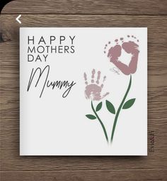 a mother's day card with handprints and flowers