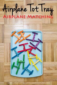 an airplane tot tray made out of clothes pins on the floor with text overlay