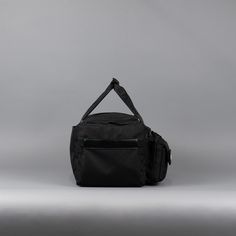 Introducing the pinnacle of travel companions: The Ultimate 30L Duffle Bag made with 1000D Oxford Waterproof Material and YKK Zippers and Clamps. This exceptional bag is meticulously designed to cater to all your needs, from jet-setting adventures to gym sessions and beyond. If anyone can make a duffle bag better, its WOLFpak! Unmatched Versatility: With a spacious 30-liter capacity, this duffle bag offers ample space for all your essentials, ensuring you're prepared for any journey. Its adaptab Black Multifunctional Nylon Travel Bag, Multifunctional Black Nylon Travel Bag, Black Waterproof Weekender Bag For Travel, Practical Waterproof Bags For Overnight Trips, Functional Travel Bag For Overnight Trips, Black Nylon Weekender Bag For Sports, Practical Waterproof Black Travel Bag, Black Waterproof Gym Bag For Travel, Practical Black Travel Accessories For Outdoor Activities