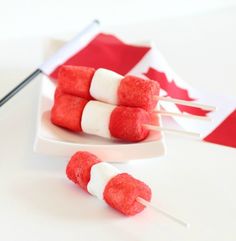 red and white marshmallows on a plate with a canadian flag in the background