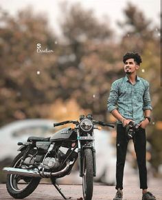 a man standing next to a parked motorcycle