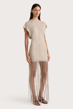 A fitted mini dress, designed from a sheer linen jersey with slight stretch. Featuring a high round neckline and short batwing-style sleeves, it is contoured through the body with a stitch detailing down the front and back. The hem is adorned with handwoven macrame, before falling into an ankle-grazing fringe skirt. Pair with a simple heel or sandal for a unique approach to occasionwear. Macrame Dress, Maxi Dress Sale, Fitted Mini Dress, Fringe Skirt, Fringe Dress, Faithfull The Brand, New Arrival Dress, Batwing Sleeve, Special Occasion Dresses