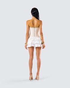 Get ready for a day full of being the center of attention 😌 Pairing an ivory canvas lace up corset top with a ivory ruffle mini skirt, this two-piece fit will have all eyes following your every move 🤍 Summer Wedding Mini Dress, Flirty White Strapless Corset, Feminine Ruffled Corset For Summer, Strapless Ruffled Flirty Corset, White Summer Corset With Corset Back, Strapless Flirty Corset With Ruffles, Feminine Overbust Corset With Ruffles, White Mini Length Corset With Corset Back, Fitted Lace Trim Mini Corset