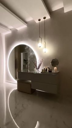 a bathroom with a sink, mirror and lights on the wall next to each other