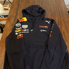 Pre-Owned 100% Authentic, Redbull Racing Team Hoodie. Officially Licensed Puma. Size Us Large. Ferrari Merch, Formula 1 Hoodie, F1 Clothing, F1 Hoodie, Redbull Racing, F1 Merch, Race Day Outfits, Hoodie Jacket Men, Mens Lightweight Jacket