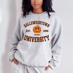 College style halloweentown university halloween sweatshirt. all SKUs Crew Neck T-shirt With University Logo For Fall, Varsity T-shirt For College In Fall, Oversized Fall T-shirt For College, Oversized Fall College Style T-shirt, Oversized College Style T-shirt For Fall, College Fall Fan Apparel T-shirt, College Fan Apparel T-shirt For Fall, Fall Campus T-shirt In College Style, Fall School Spirit Sweatshirt With Screen Print