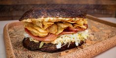 a close up of a sandwich on a cutting board