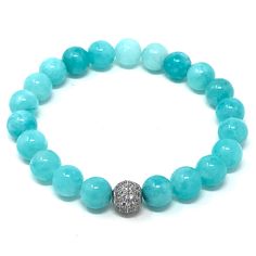 Precious looking dyed Amazonite gemstones bracelet ● elegant, simple and meaningful! Amazonite is a very ancient gemstone that's known for its beauty and healing properties. It helps with physical ailments, emotional issues, and in Energy Healing and chakra balancing. Amazonite crystal therapies are primarily associated with filtering out stresses, healing traumas, and soothing energies in the home and workplace.Materials:- 8mm high quality dyed amazonite beads- 8mm metal bead pave with zircon** Elegant Amazonite Bracelet For Healing, Amazonite Crystal, Bracelet Elegant, Metal Bead, Crystal Therapy, Chakra Balancing, Seed Bead Jewelry, Bead Jewelry, Gemstone Bracelets