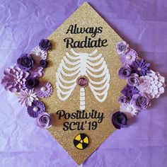 a graduation cap decorated with flowers and the words, always radiate positivity scu'19