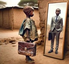 a young boy standing in front of a mirror with a briefcase on his chest and the reflection of him