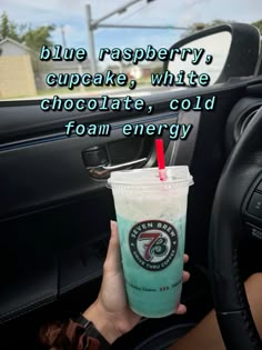 a person holding a drink in their hand with the caption blue raspberry cupcake white chocolate, cold foam energy