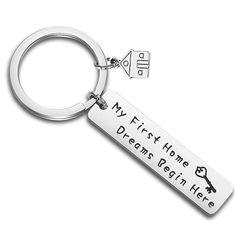 a keychain that says, my first home is the dreams paid here on it