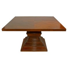 a square wooden table with four steps on each side