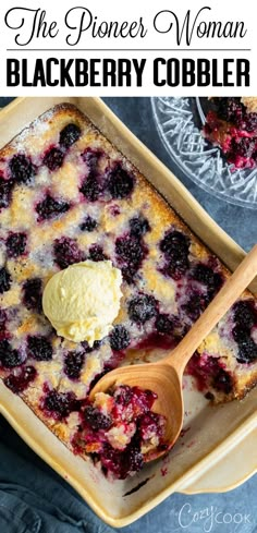 a blueberry cobbler with ice cream on top in a yellow casserole dish