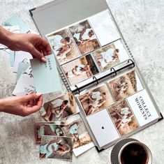 a person is taking pictures with their cell phone and some papers on the table next to them