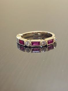 Dekara Designs Collection Metal- 18K Yellow Gold, .750. Stones- 4 Genuine Baguette Rubies 0.75 Carats, 5 Round Diamonds G Color VS2 Clarity 0.30 Carats. Size- 4-12 Beautiful Handmade 18K Yellow Gold Ruby and Diamond Band. This band features four amazing baguette rubies that are vibrant and fiery professionally burnish set with milgrain/bead work surrounding each stone. There are five round fiery diamonds that are expertly burnish set with bead work surrounding each stone as well. Great ring for Gold Ruby Ring With Baguette Diamonds For Anniversary, Elegant Yellow Gold Ruby Ring With Baguette Diamonds, Yellow Gold Ruby Eternity Band, Yellow Gold Ruby Baguette-cut Jewelry, Luxury Baguette-cut Ruby Ring Fine Jewelry, Gold Art Deco, Engagement Bands, Ruby Diamond, Baguette Diamond