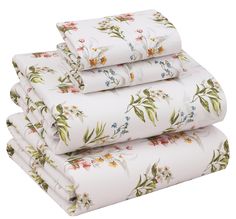 four sheets are stacked on top of each other, with flowers and leaves all over them