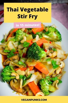 a white plate topped with broccoli, carrots and other veggies