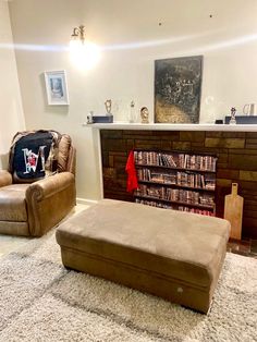 a living room filled with furniture and a fire place in the middle of the room