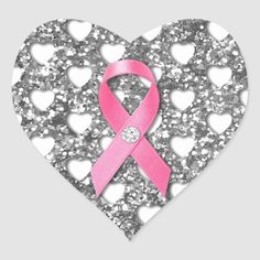 a heart shaped sticker with hearts and a pink ribbon on the center, surrounded by silver sequins