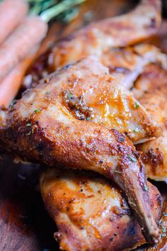 some chicken and carrots on a wooden table