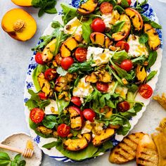 a salad with grilled peaches, tomatoes and mozzarella