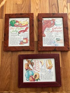 two framed pictures on a wooden table next to each other with different types of food in them